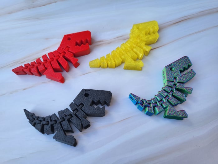 llavero dinosaurio articulado