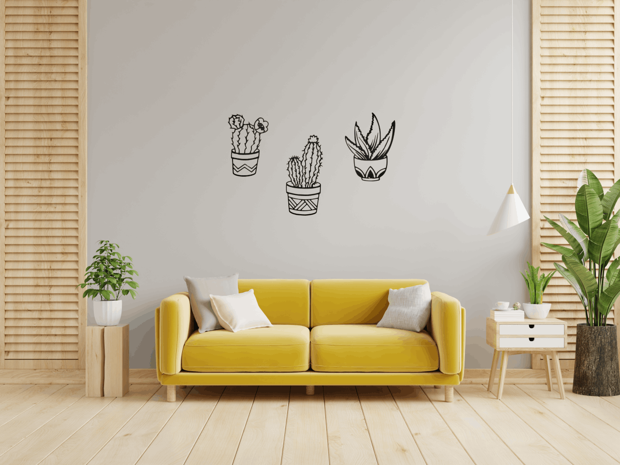 cactus decoración pared con sillón amarillo